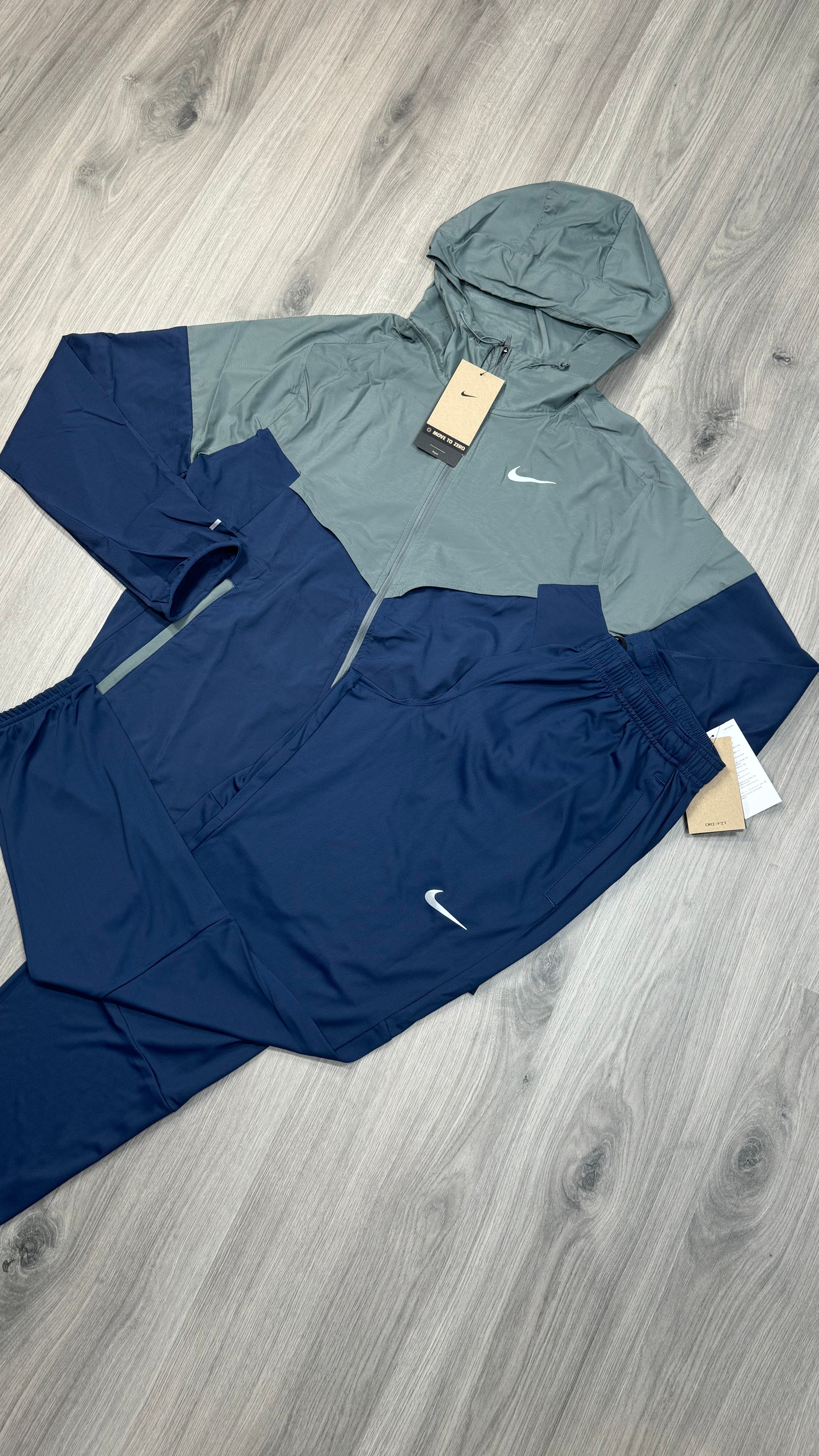 Nike Windrunner jacket and Challenger running trousers set in navy and grey