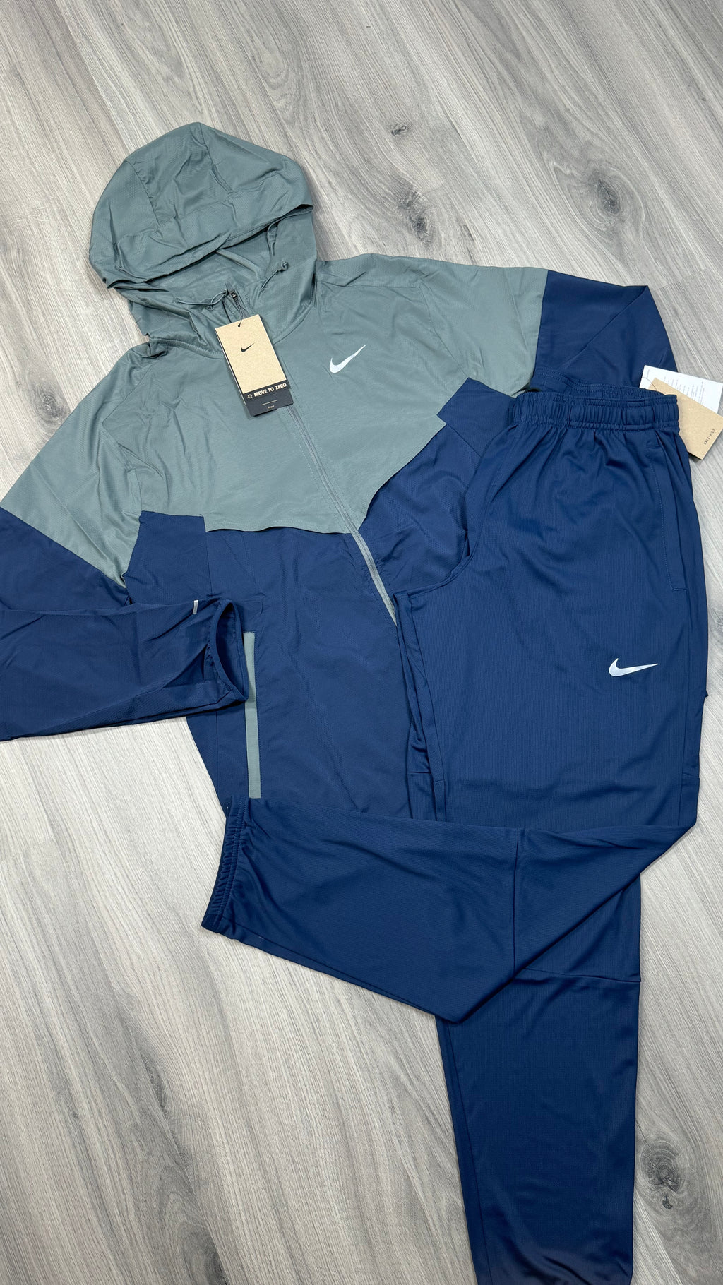 Nike Windrunner jacket and Challenger running trousers set in navy and grey