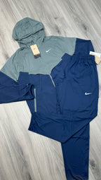 Nike Windrunner jacket and Challenger running trousers set in navy and grey