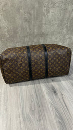 Louis Vuitton Keepall Bandoulière 55 in Monogram Macassar canvas with black leather trim