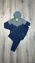 Nike Windrunner jacket and Challenger running trousers set in navy and grey