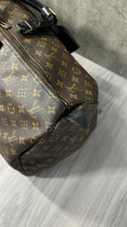 Louis Vuitton Keepall Bandoulière 55 in Monogram Macassar canvas with black leather trim