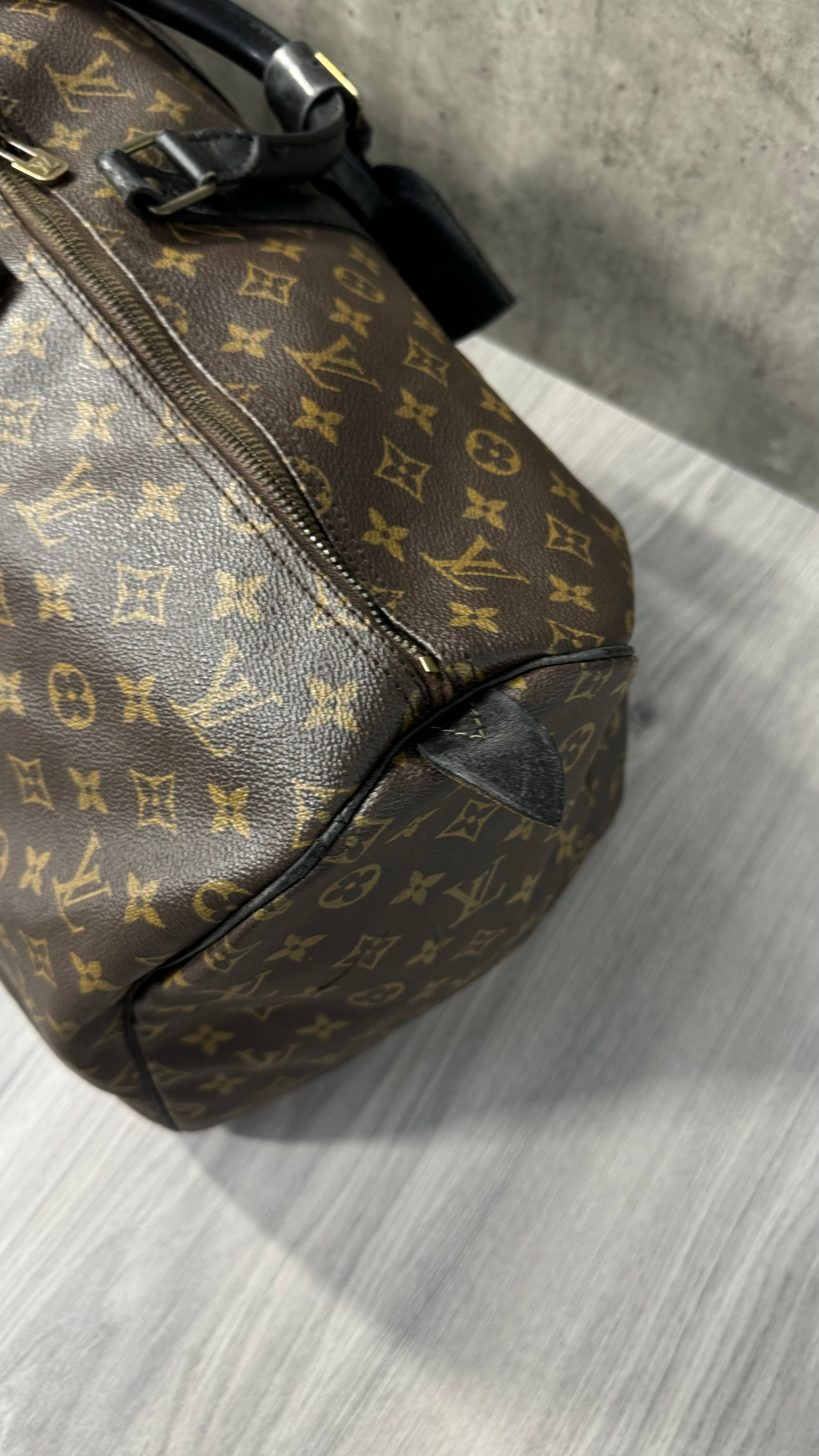 Louis Vuitton Keepall Bandoulière 55 in Monogram Macassar canvas with black leather trim
